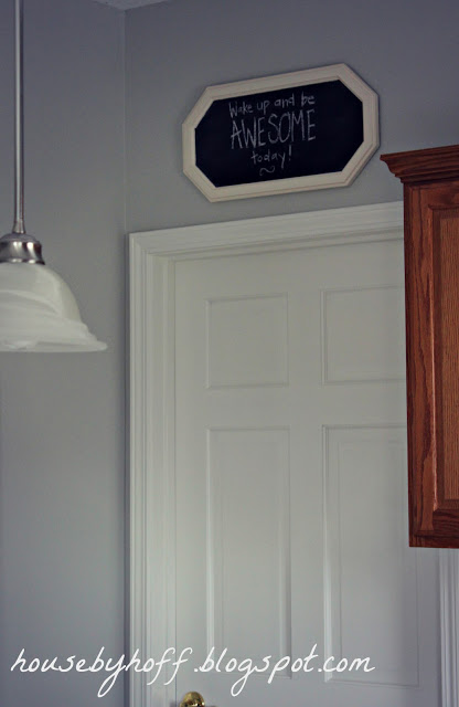 The chalkboard above a door in the kitchen.