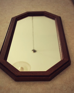 A mirror lying on the floor.