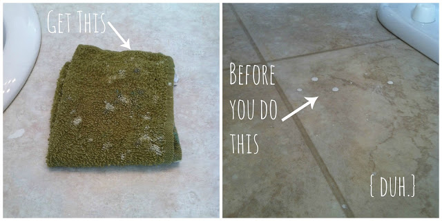 Green cloth on floor with paint drops.