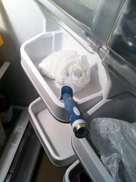 Paint roller brush in fridge.