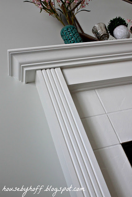 how to improve an outdated fireplace via housebyhoff.com A white fireplace mantel.