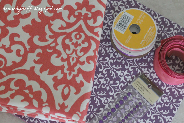 Purple and red graphic paper with decorations on the counter.