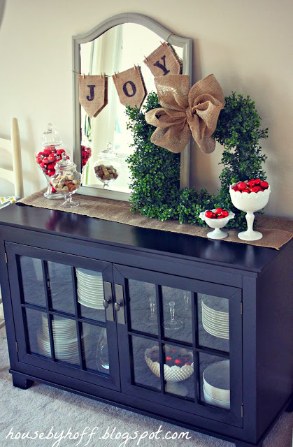 The Christmas wreath on a cabinet.