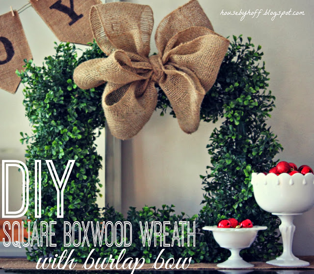 Green wreath with burlap bow.
