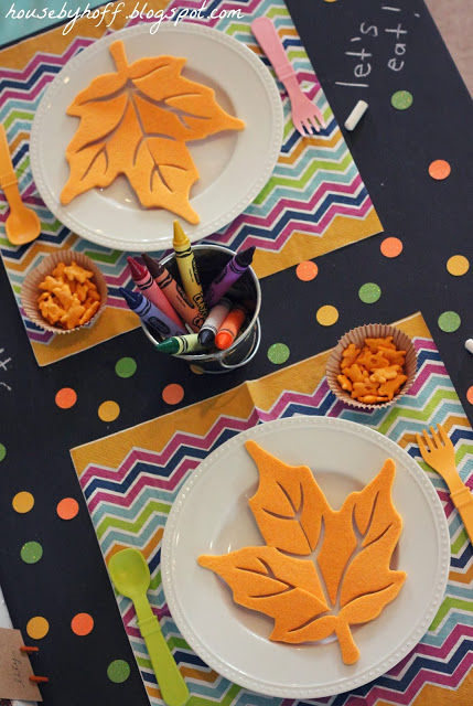 Little animal crackers, plates with yellow leaves and colourful placemats.