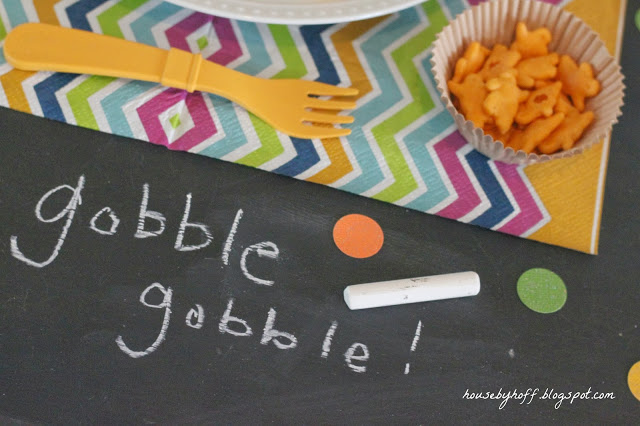 Gobble gobble written in chalk on the table.