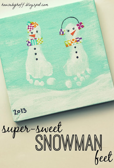 A child's artwork, her feet turned into snowmen.