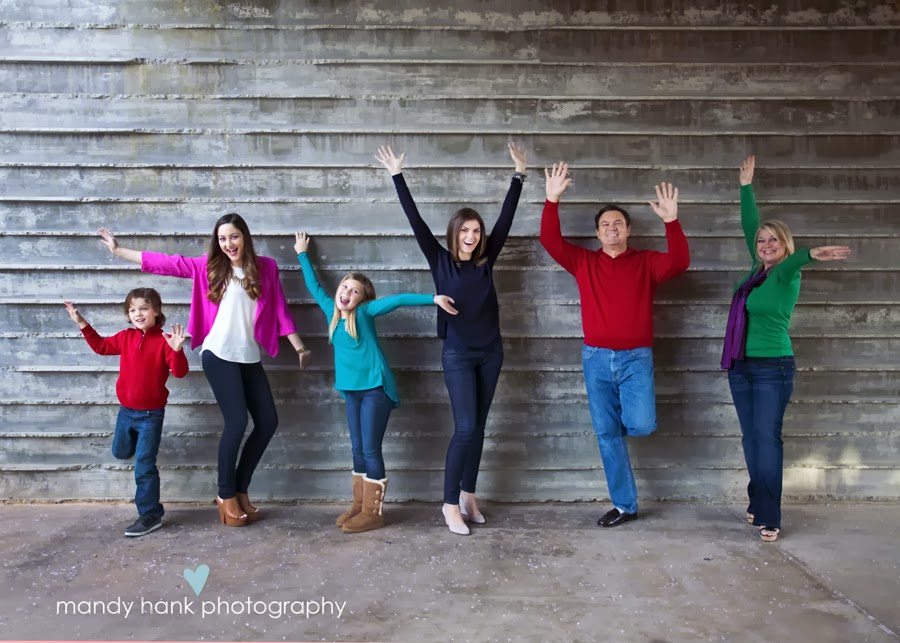 tips for family photos via housebyhoff.com A family of six waving their arms in the air.