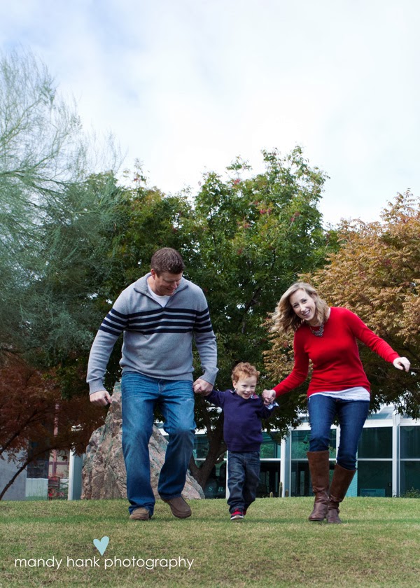 tips for family photos via housebyhoff.com Mom Dad and child skipping in the grass.