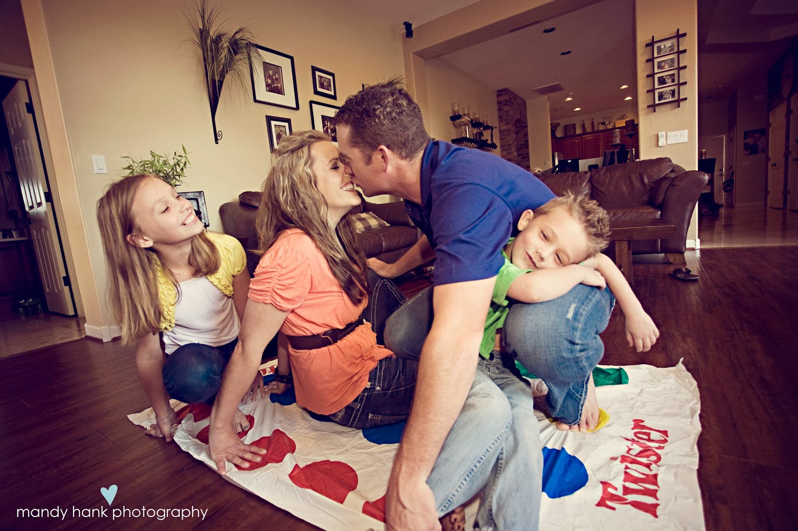 tips for family photos via housebyhoff.com Family playing Twister.