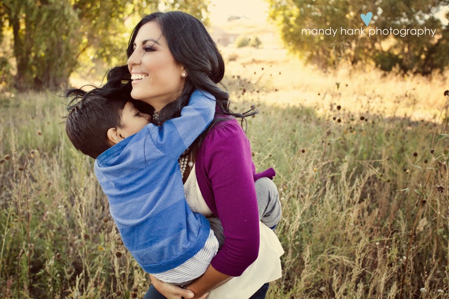 tips for family photos via housebyhoff.com A Mom holding her child with his arms around her neck.