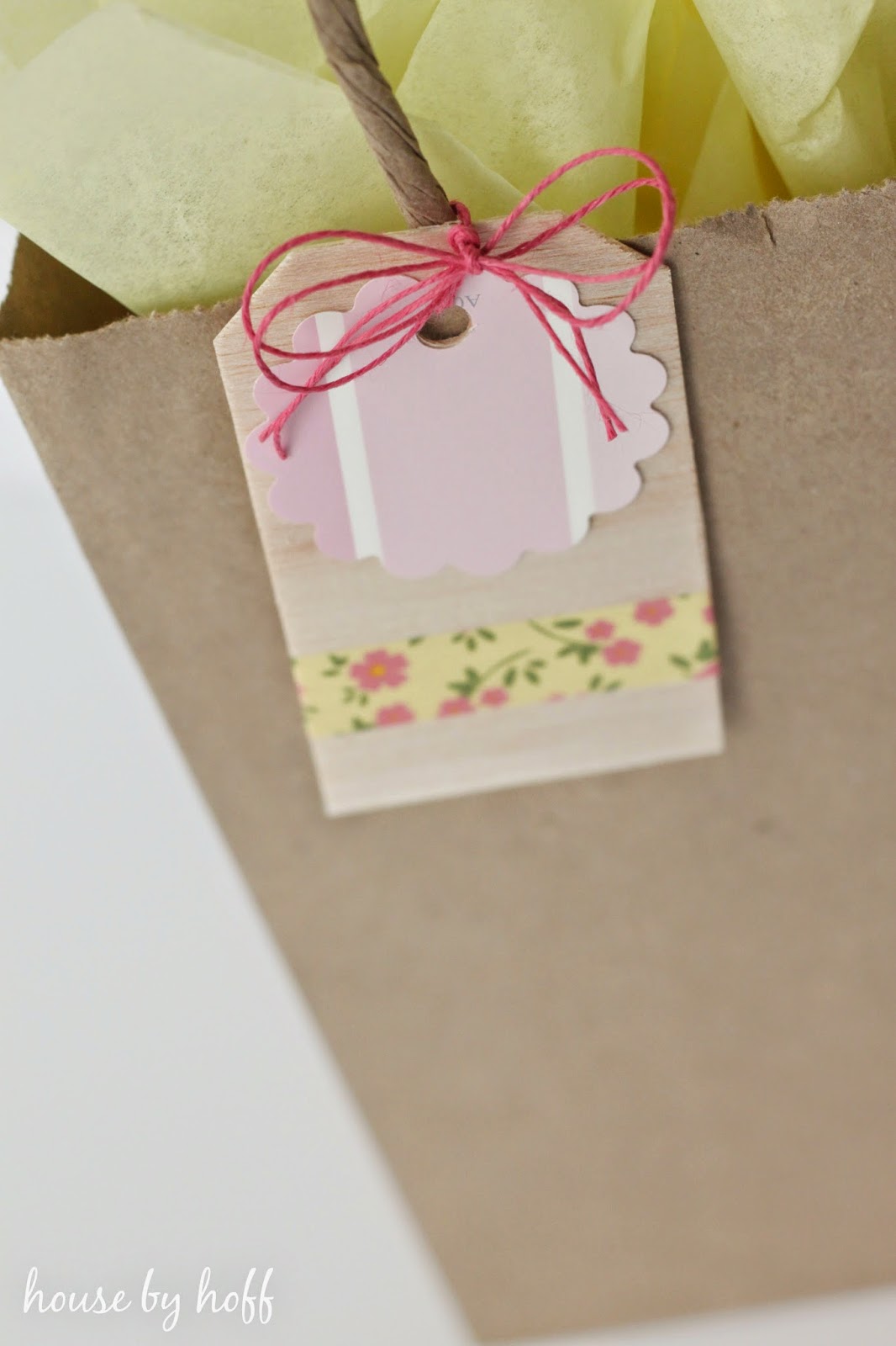 how to make gift tags via housebyhoff.com Balsa wood gift tag on a paper gift bag.