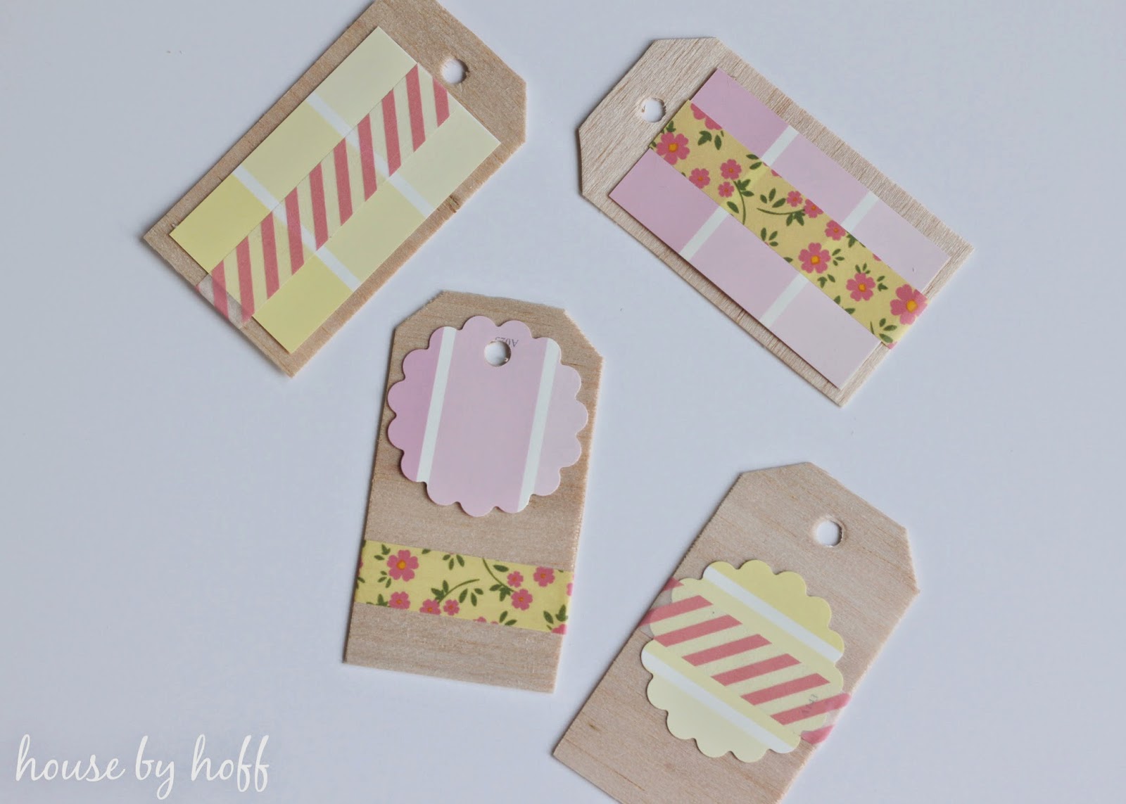 The gift tags put together with floral and pink and yellow.