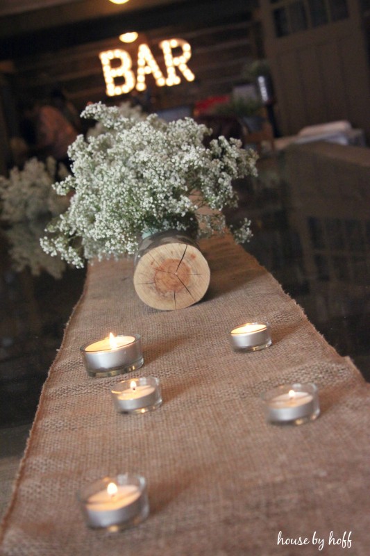 Baby's breath on table with tea lights.