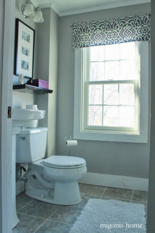 Purple accents in a neutral bathroom.