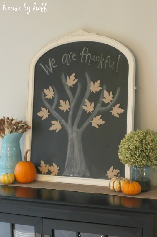 Chalkboard Tree with Burlap Leaves and pumpkins on the hutch in dining room.