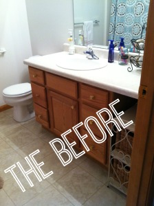 Brown cabinets and white counter in the before picture of the bathroom.