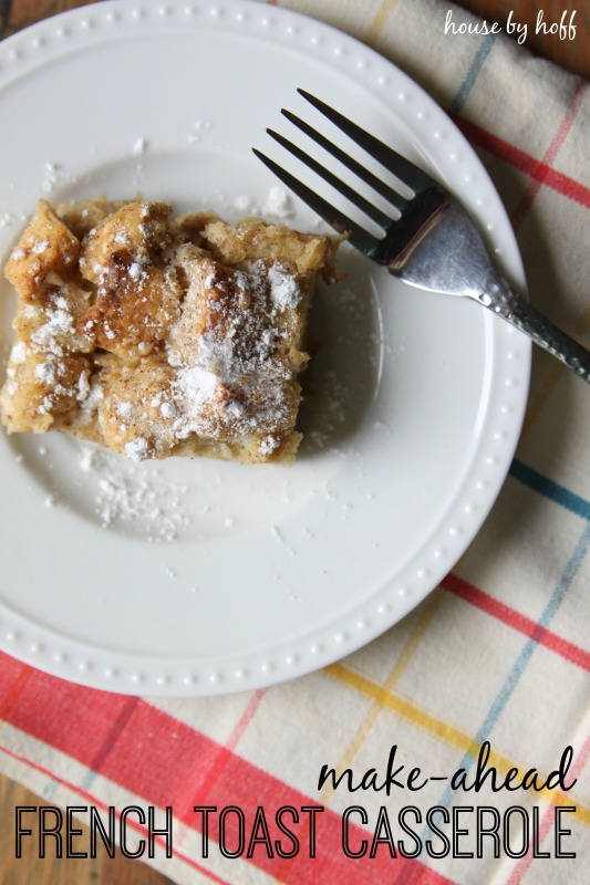 White plate with a piece of French toast casserole on it.