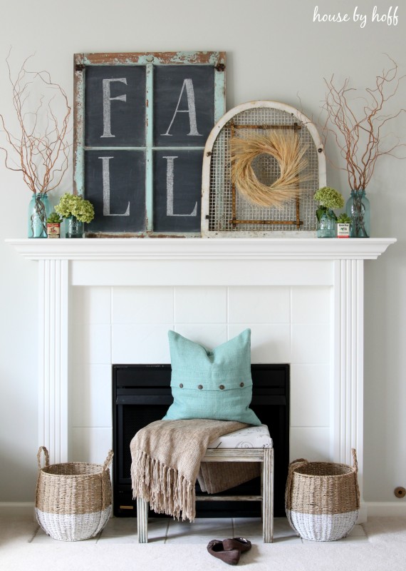 Fall mantel decor with wooden sign on mantel.