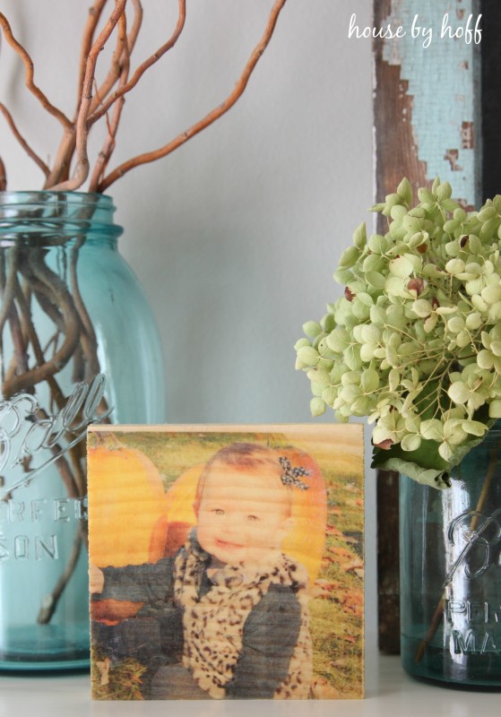 The wooden photo displayed on a table.