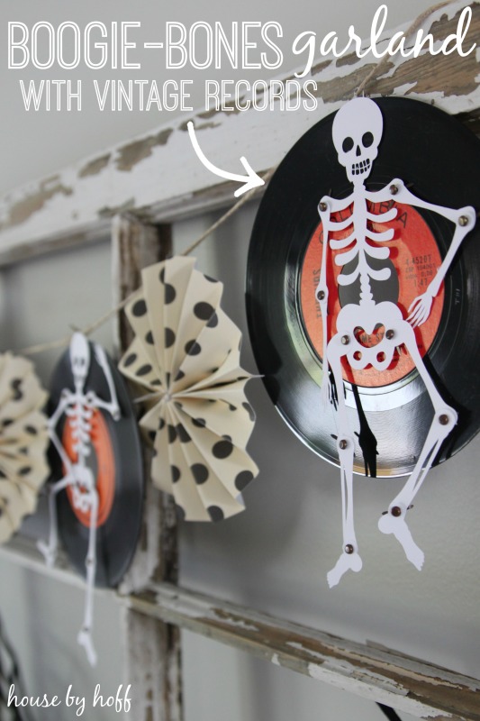 Skeleton on a record, hanging up on the wall.