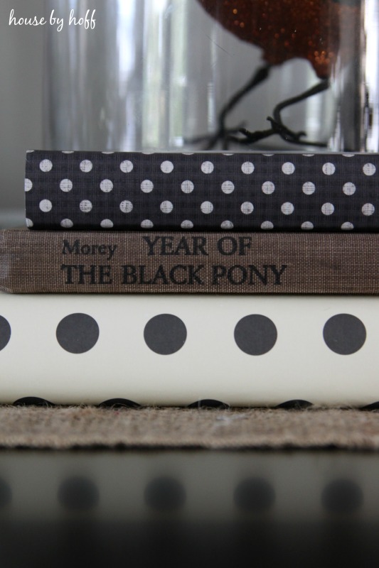 Three books stacked up with year of the black pony in the middle.