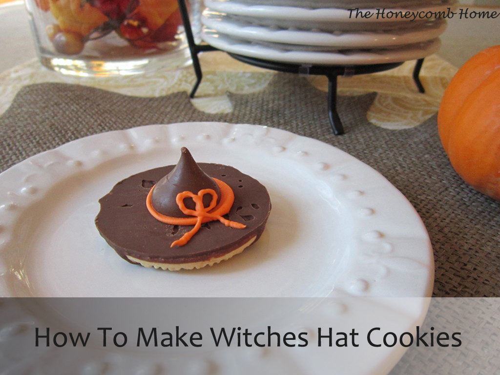 Witches hat cookies with brown hats and orange trim.