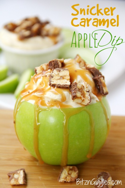 Snicker caramel dipped apple with the caramel oozing down the side.