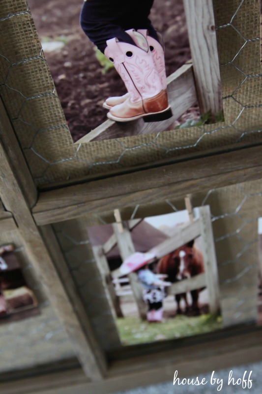 Picture of a little girl in her pink cowboy boots hanging on the frame.