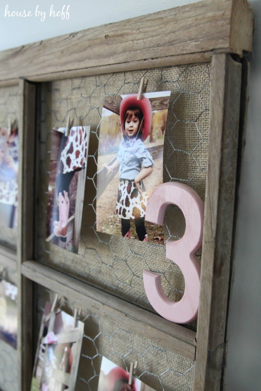 Picture of a little girl hanging on the display with the number 3.