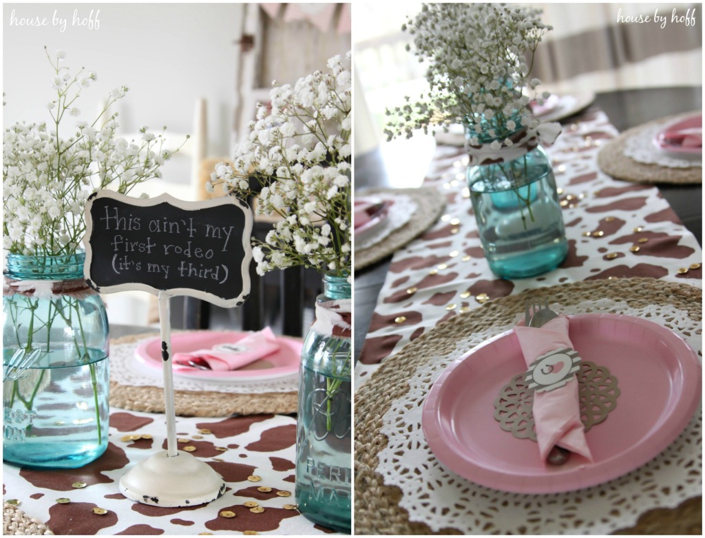 Pink plates and cowhide runner on table.