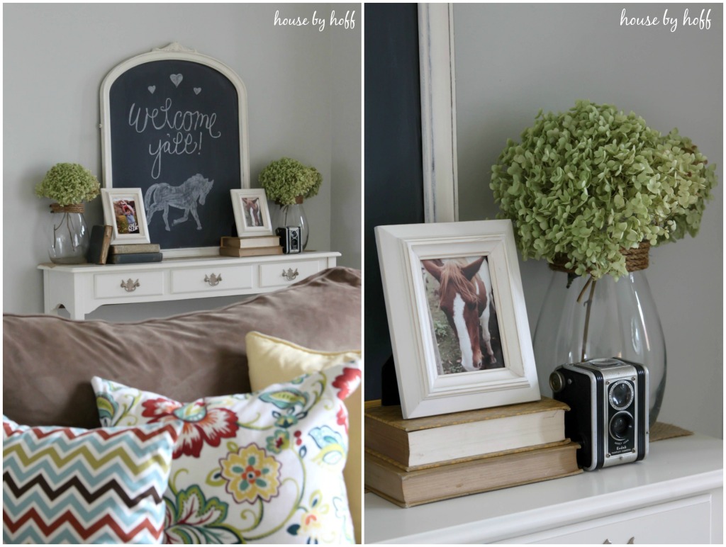 Horse pictures in frames on side table.