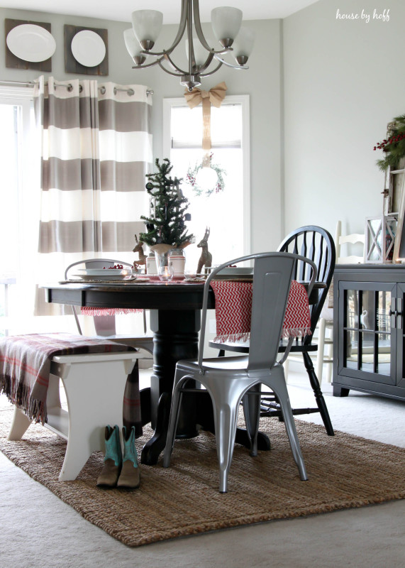 Holiday Home Tour Dining Room with a wooden table and neutral rug.