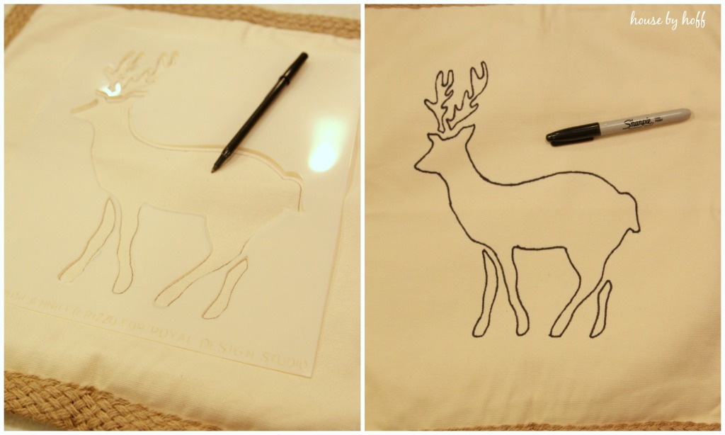 The reindeer stencils on the table with a pen.