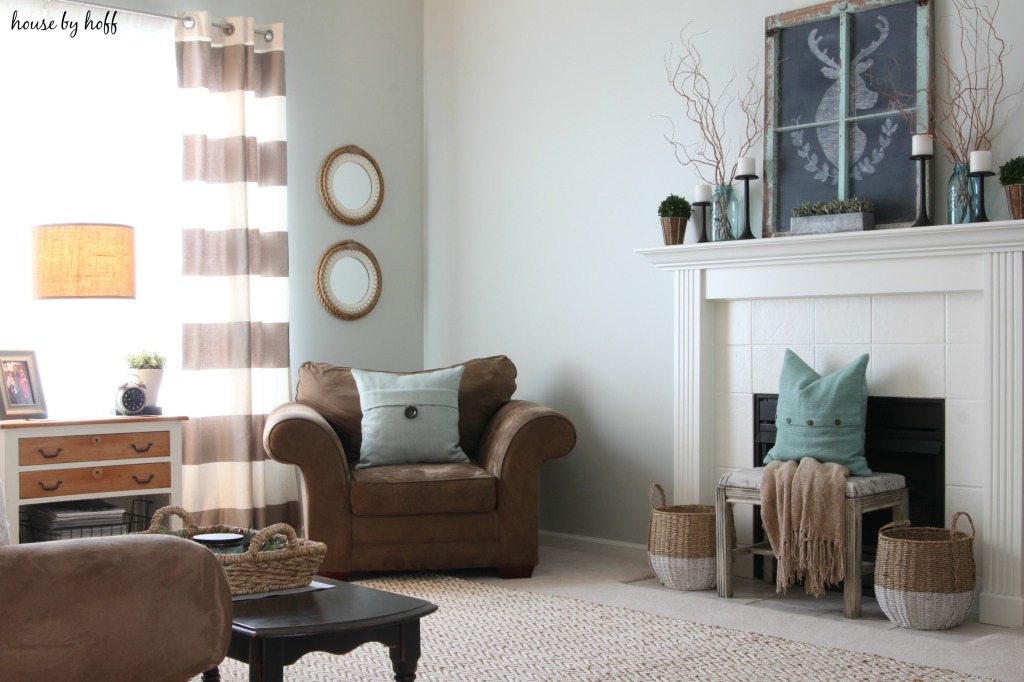 Brown couches and blue pillows in the living room.