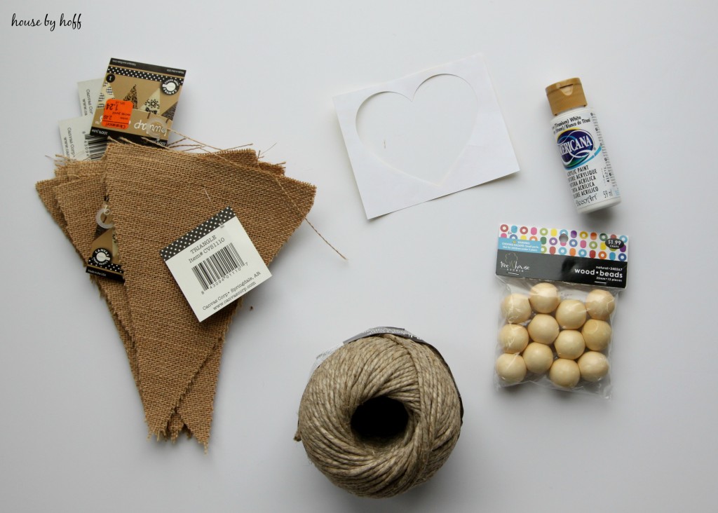 All the supplies for the pennant, the burlap, twine, wooden beads and paint.