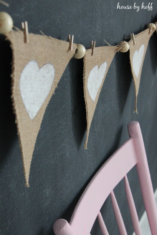 The triangle hearts with beads strung together to make the pennant on the chalkboard.