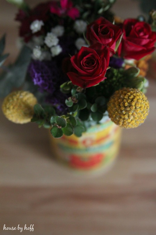 Up close of the red roses in the can.