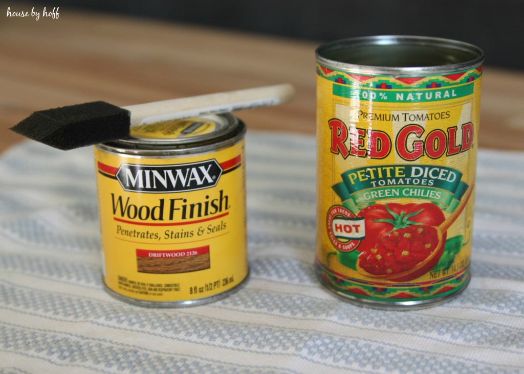 The tin can on the table beside a can of finish minwax.