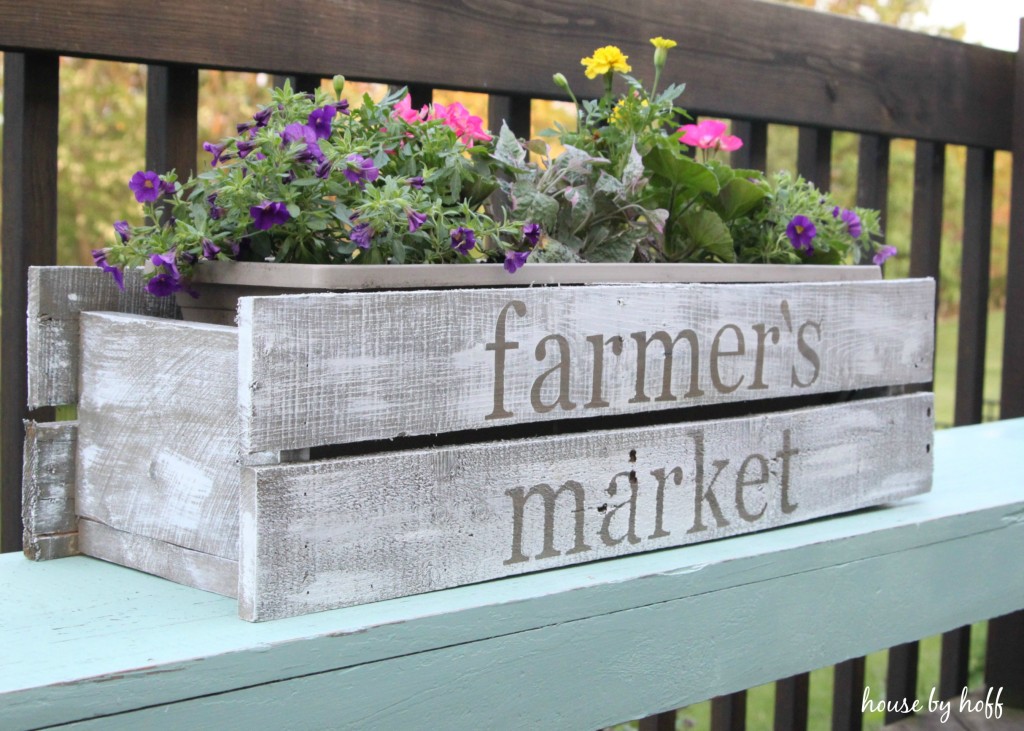 Planter box with the words farmer's market on it.