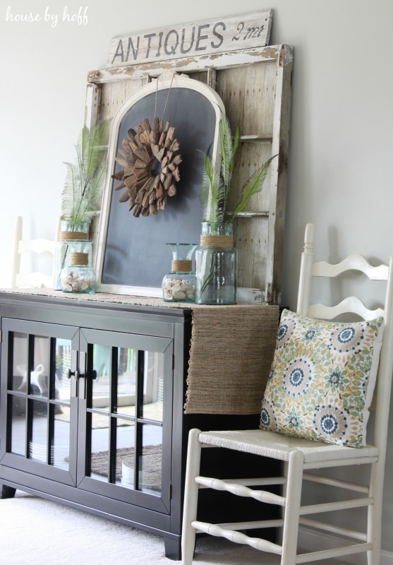 Hutch in dining room with chair beside it.