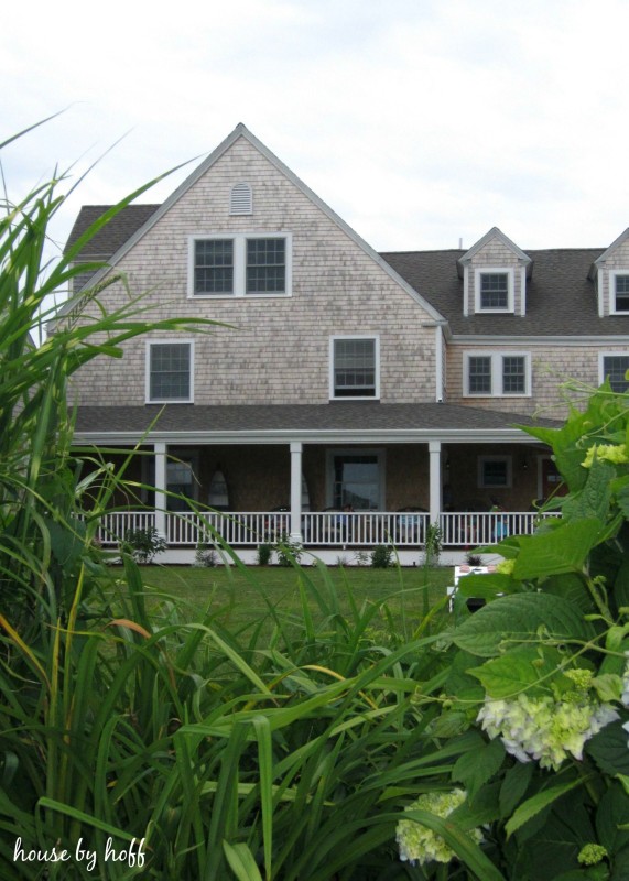 The Inn called the Beach Breeze a grey and white hotel.