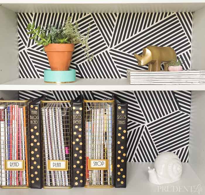 Black and white fabric behind bookshelf.