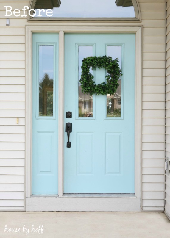 Light blue door and off white house.