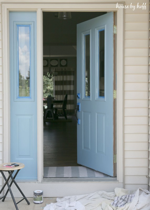 Drop sheet and paint in front of door.