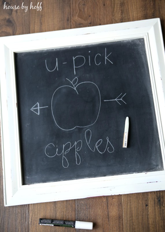 Writing out words on a chalkboard.