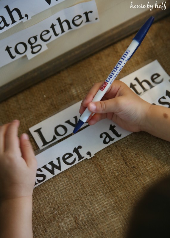 Using a sharpie on the word signs.