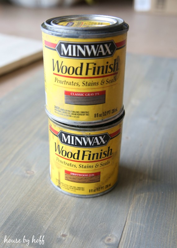 Minwax wood finish stain and seal cans on the counter.