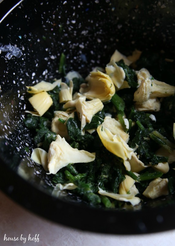 Artichoke and spinach in a bowl.