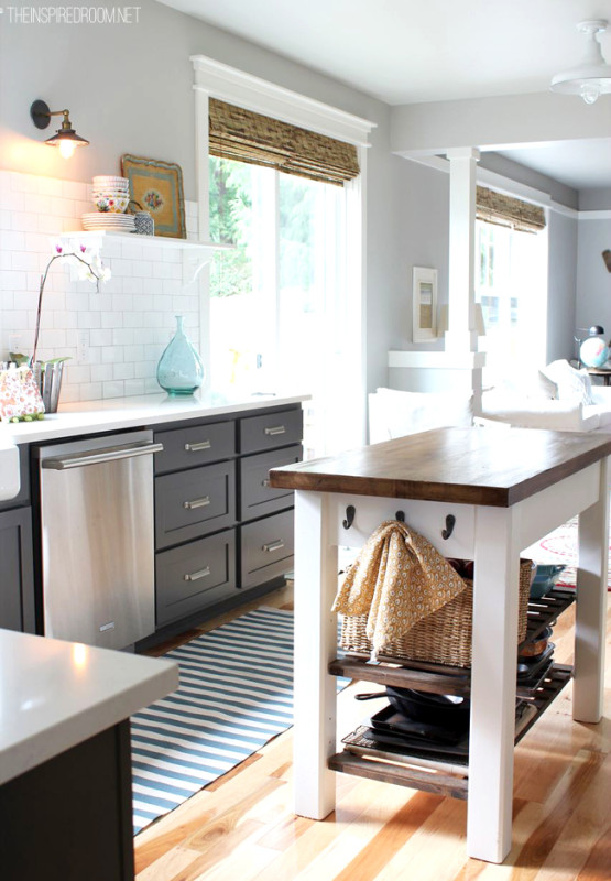 Grey kitchen cabinets with bamboo shades.